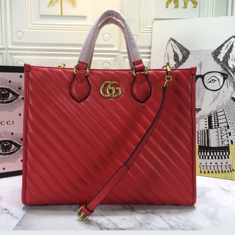 G*u*i shopping bags
